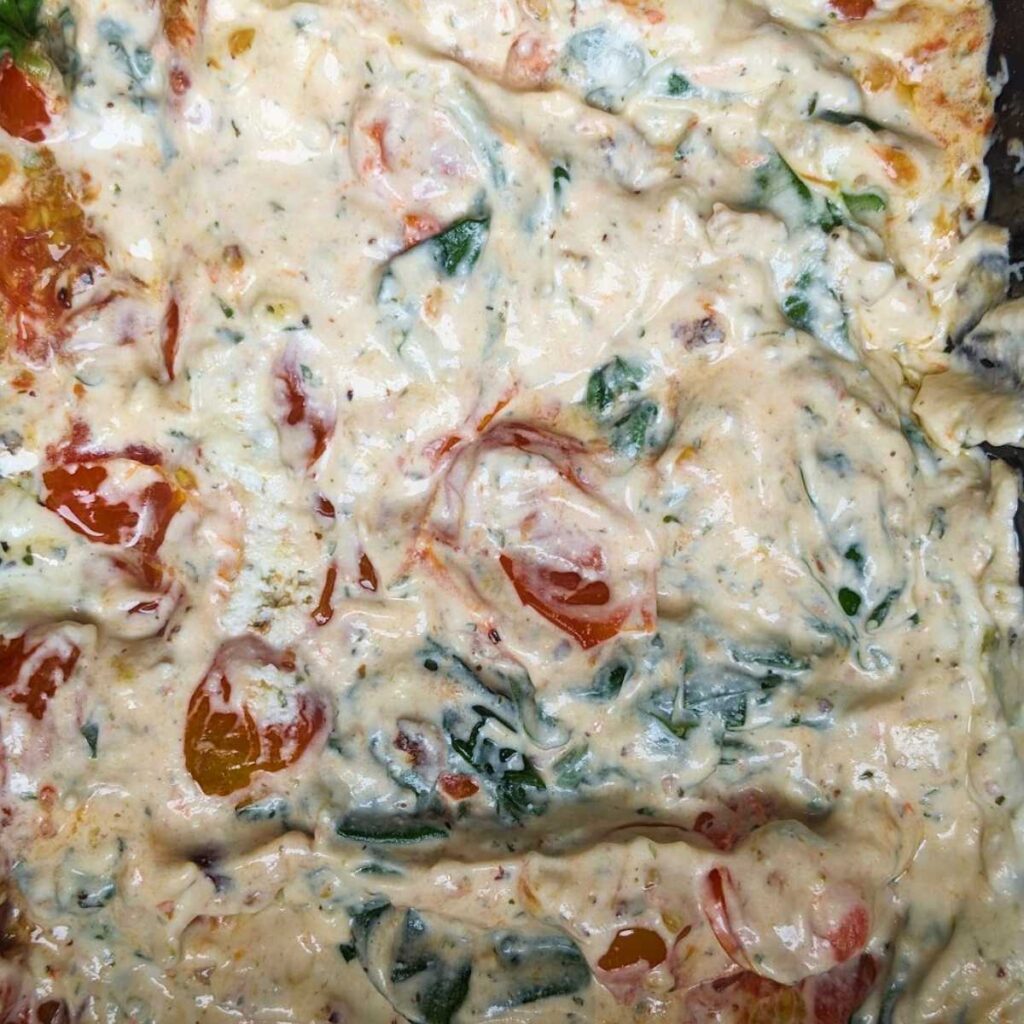 Boursin pasta sauce with tomatoes and spinach.