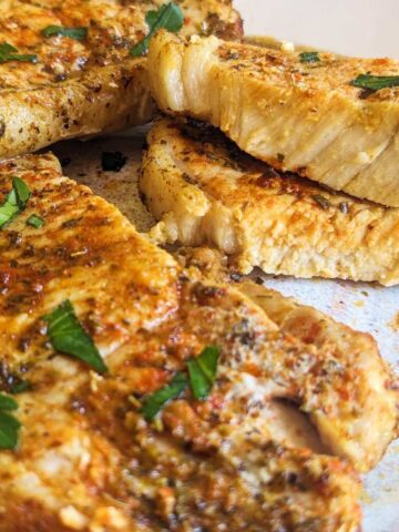Air fryer thin pork chops on a plate.